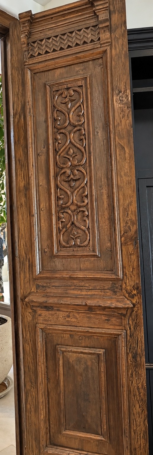 Carved wood door panel detailing