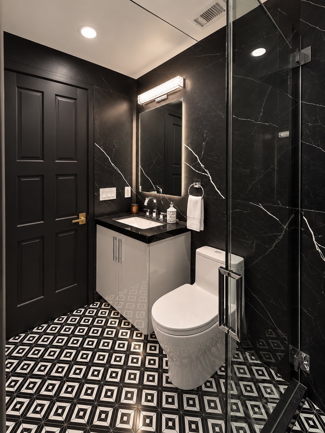 Bathroom vanity beside the glass shower